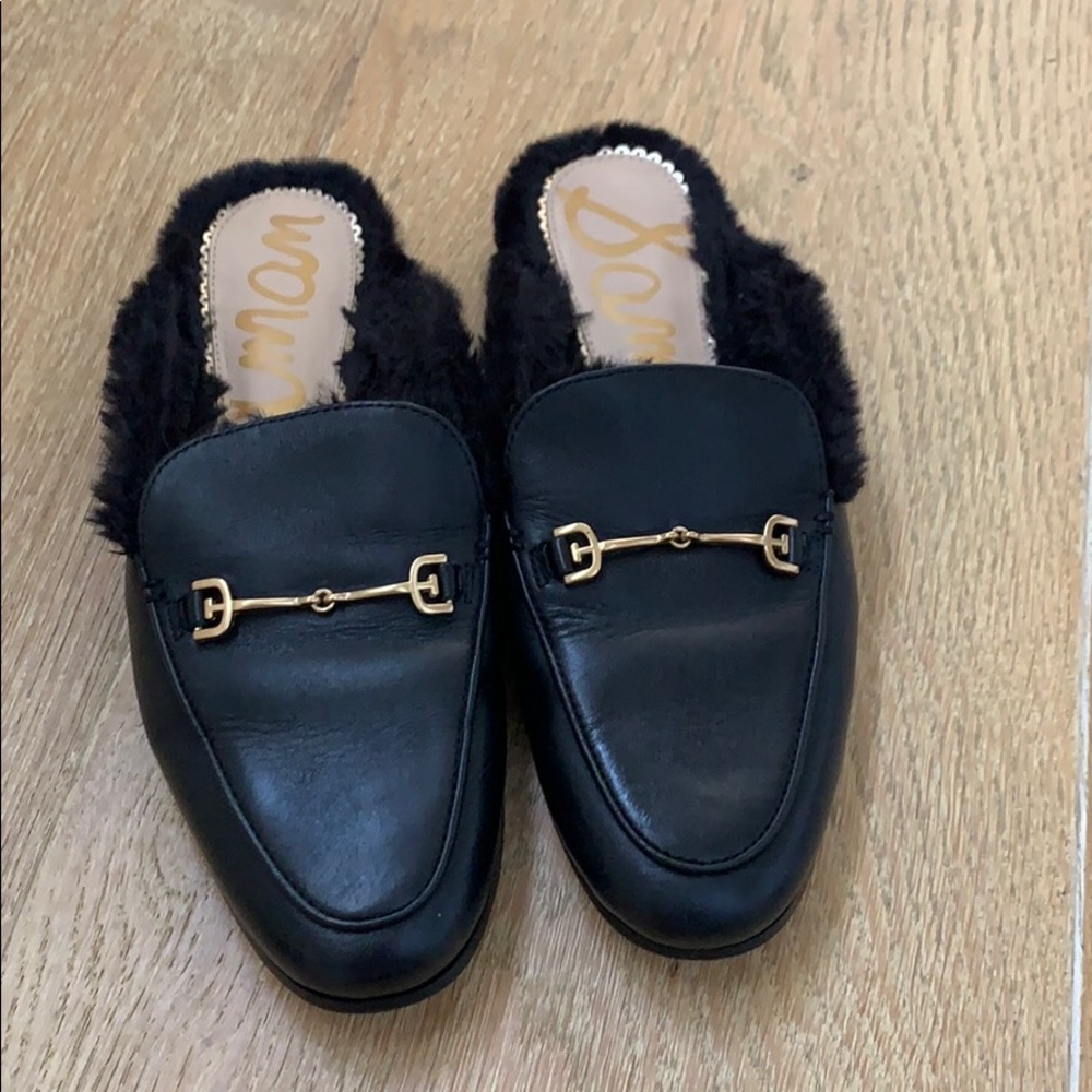 Black mule with black fur and gold detail